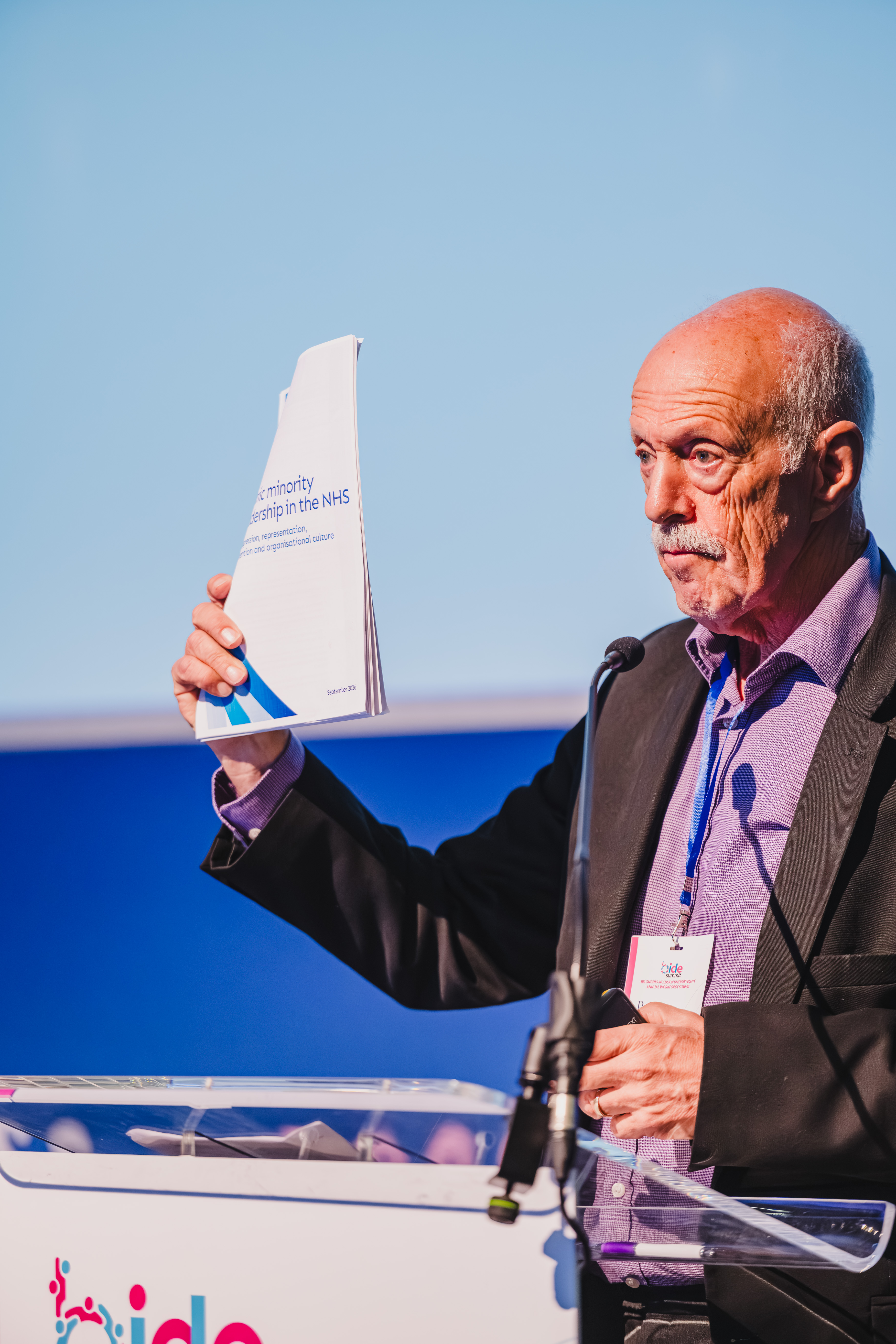 B.I.D.E summit speaker highlighting a report on NHS leadership