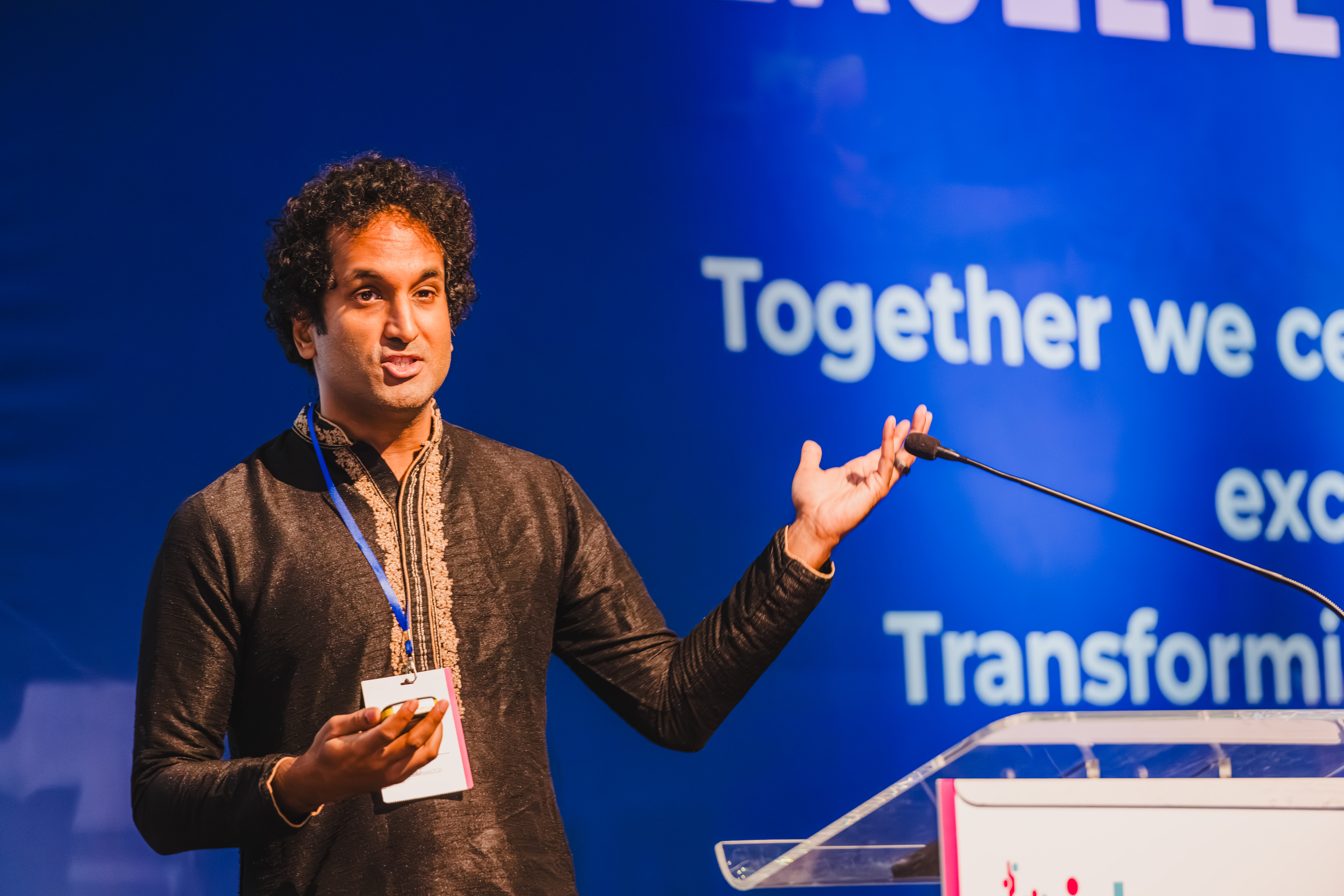 B.I.D.E summit speaker emphasising a point during a presentation